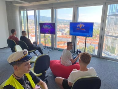 A group of people sitting in chairs in a room